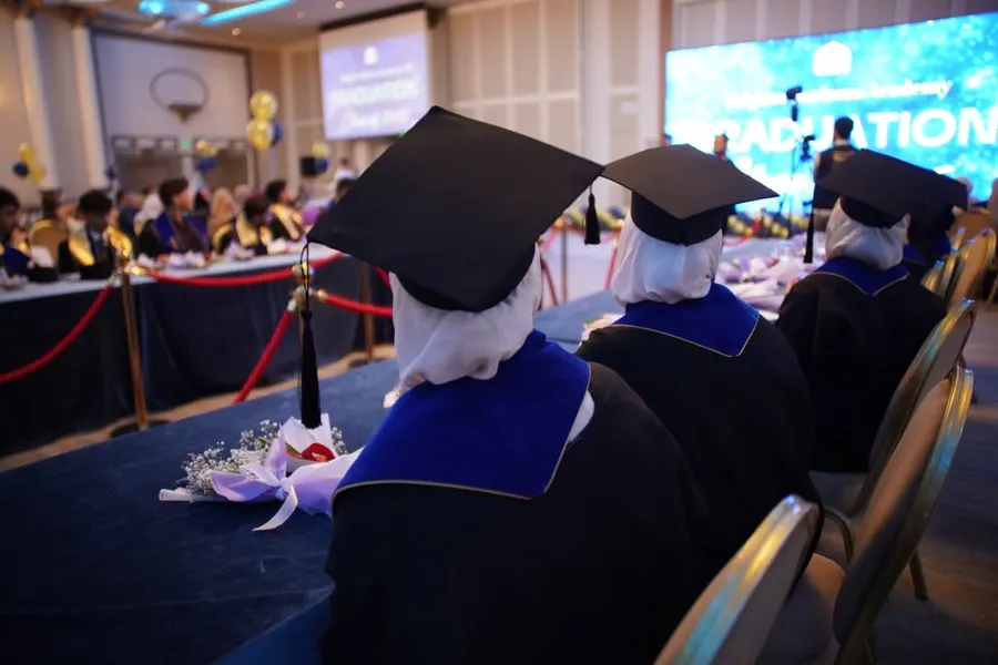 BHA graduates in cap and gown at the graduation ceremony