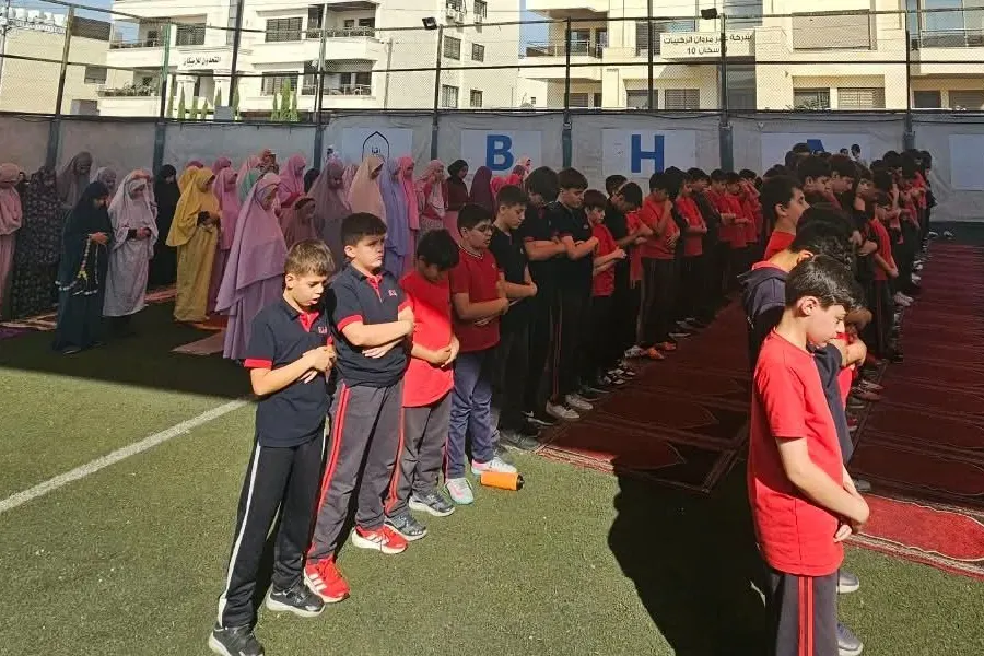 BHA students praying together in congregation at school
