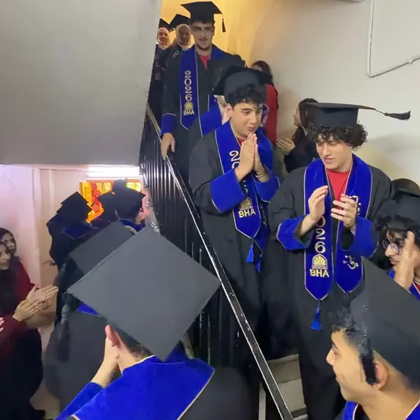 Graduates throwing their caps