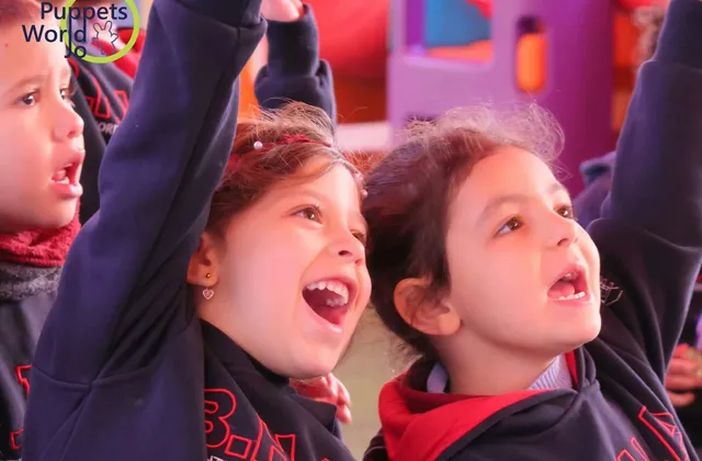 Kindergarten pupils cheering during an activity