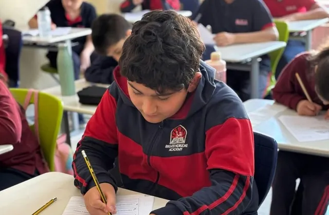 A middle school student working through an exercise in class